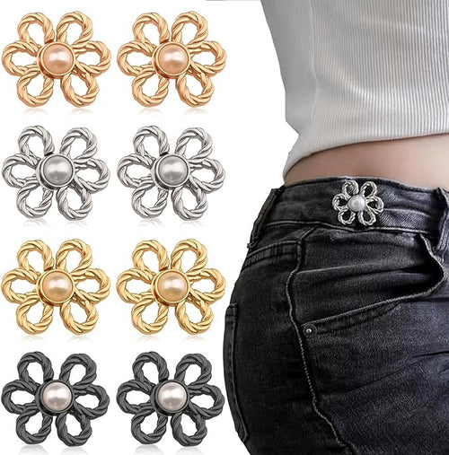 Boutons de jean ajustables en forme de fleur à perle, coloris argent, doré, noir et or rose, avec un modèle argent porté sur la ceinture d'un jean noir